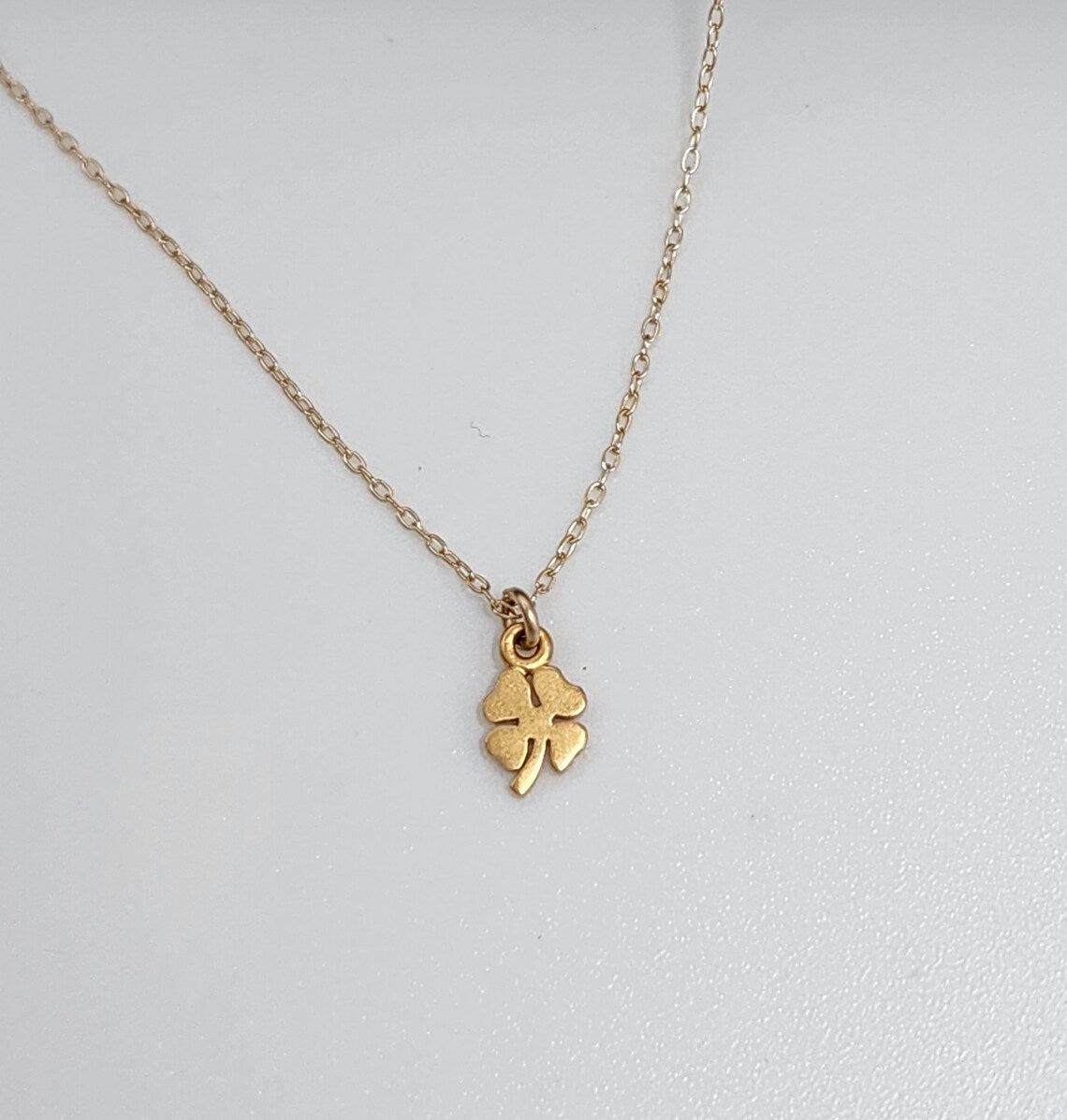 Tiny Gold Shamrock Necklace – Matte Vermeil Charm on 16" Chain
