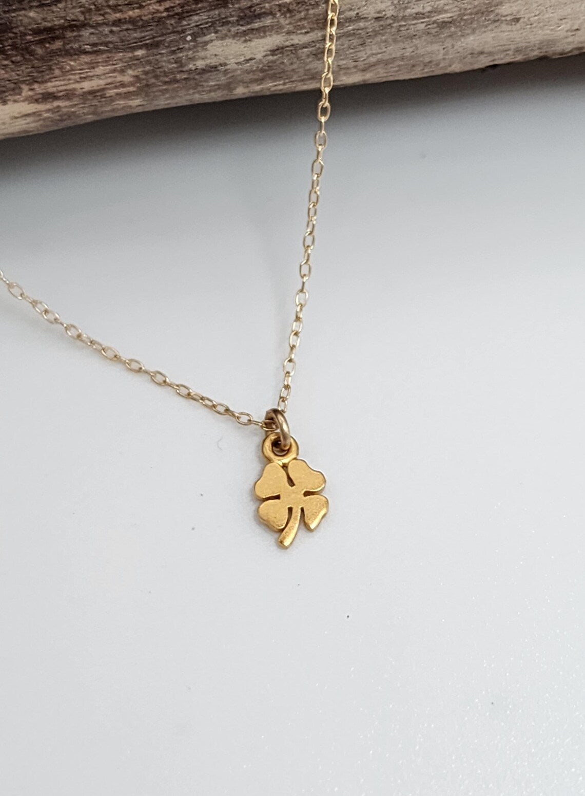 Tiny Gold Shamrock Necklace – Matte Vermeil Charm on 16" Chain