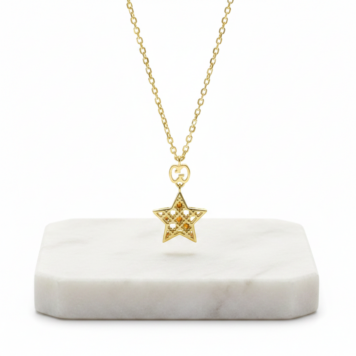 PRE-OWNED Gucci Diamantissima Star · 18K Yellow Gold