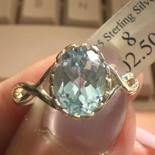 Sterling Silver Oval Blue Topaz Ring with Infinity Twist Band (Size 8)