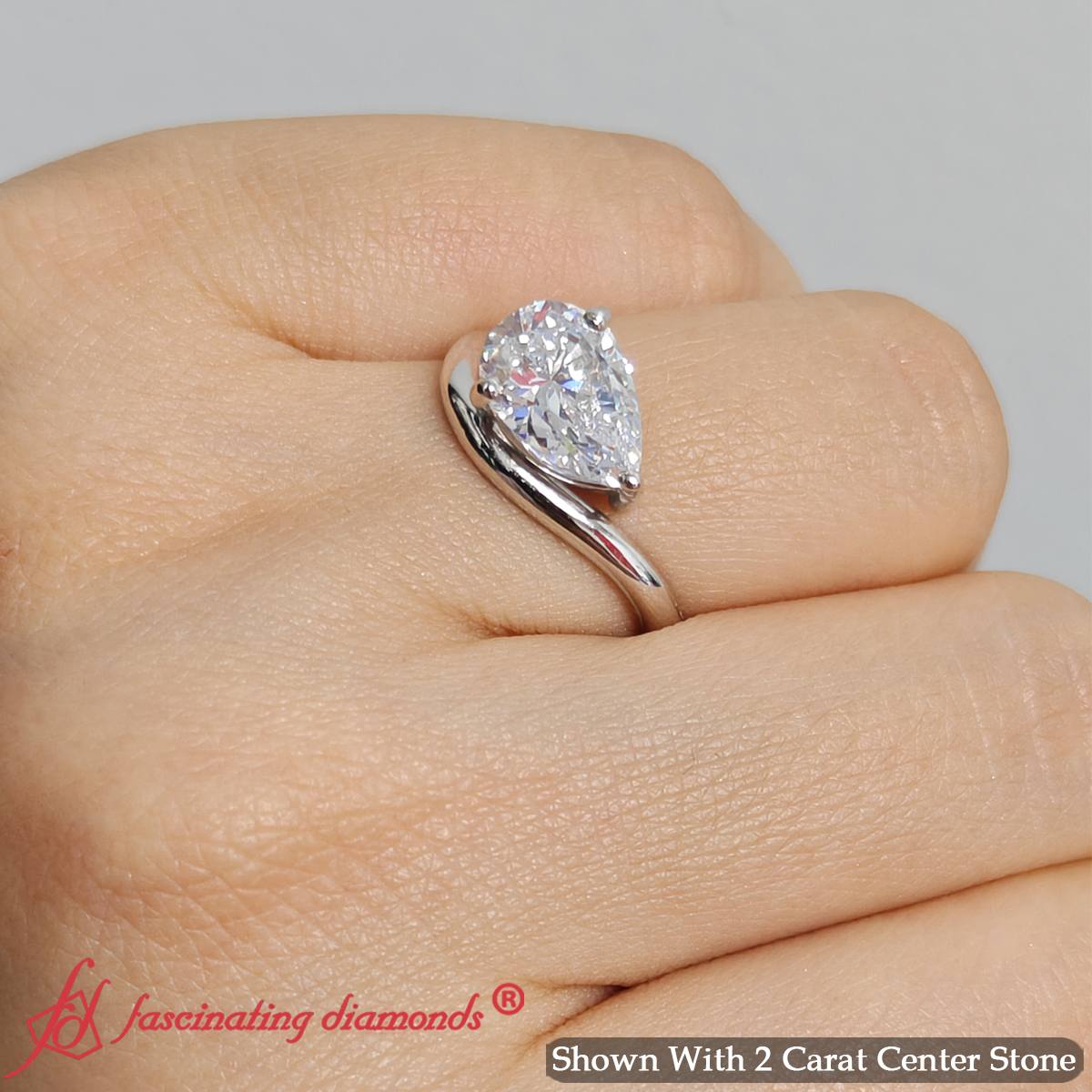 Pear Shaped Curve Shank Solitaire Diamond Ring
