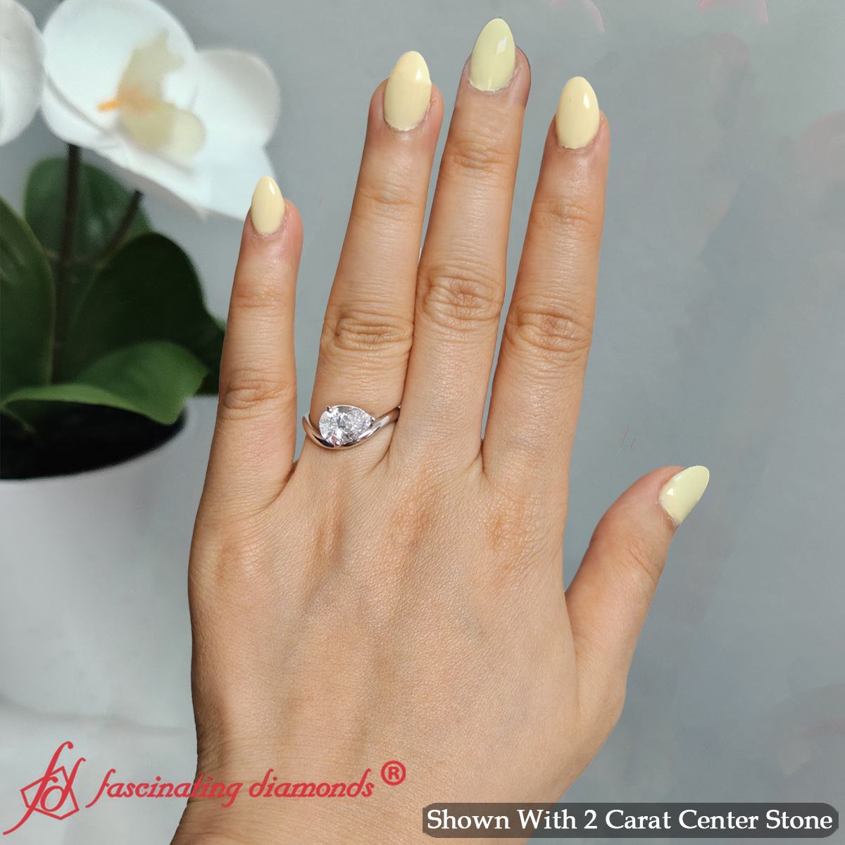 Pear Shaped Curve Shank Solitaire Diamond Ring