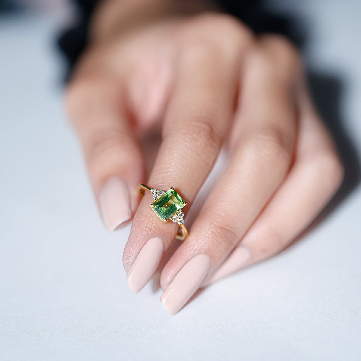 Emerald Cut Peridot Engagement Ring with Diamond Trio