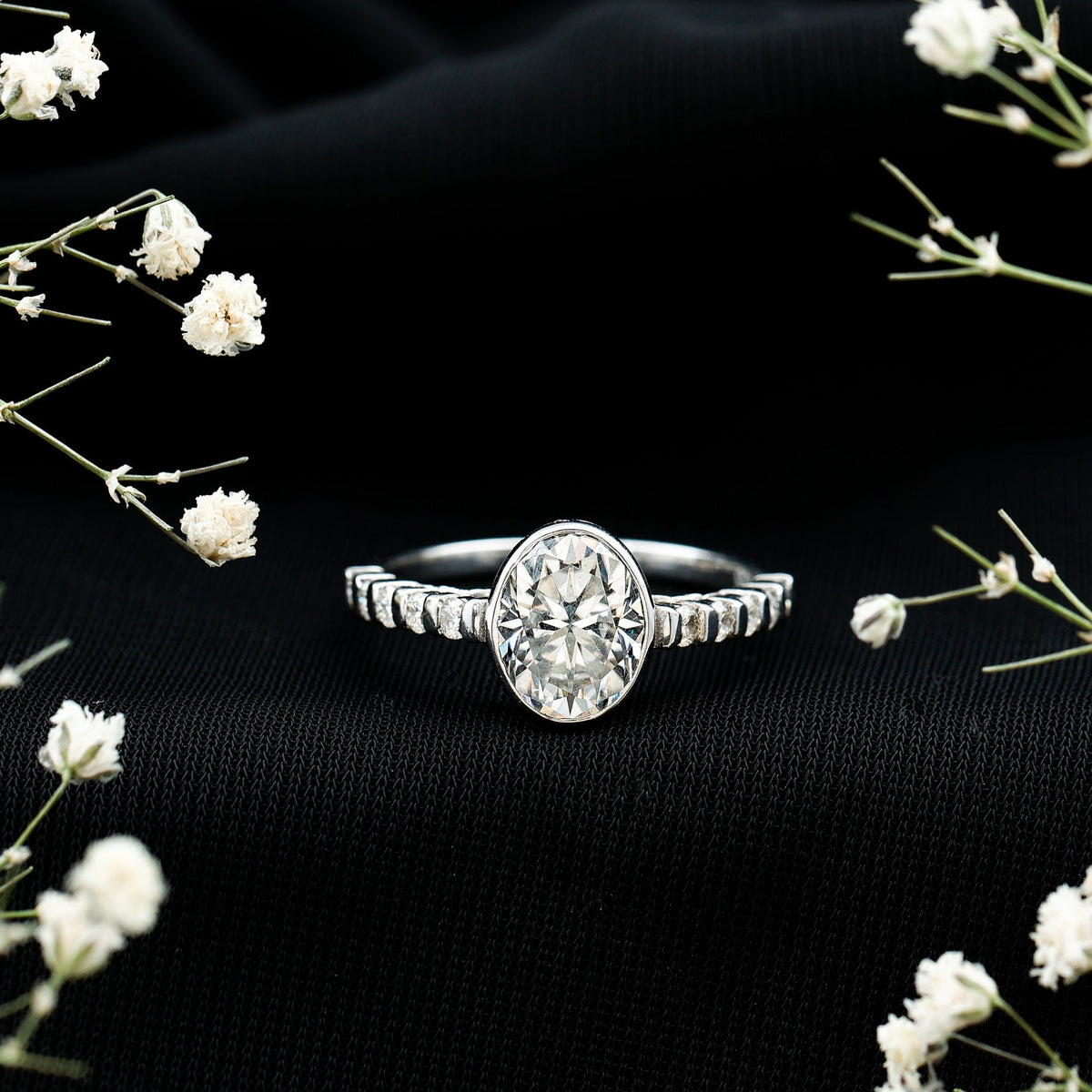 Bezel Set Moissanite Oval Engagement Ring with Side Stones