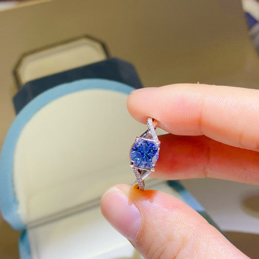 1 Carat Blue Brilliant Round Cut Sparkala™ Crisscross Pure Sterling Silver Ring