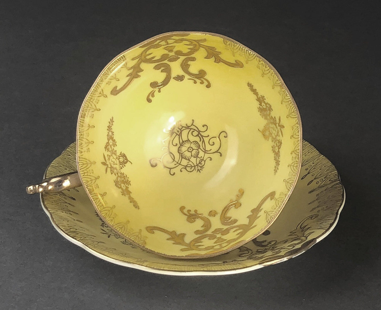 Antique Cup and Saucer Set by Royal Sealy China, Japan. Yellow Cup and Saucer with Rich Gold Decor and Iridescent Background Outside.
