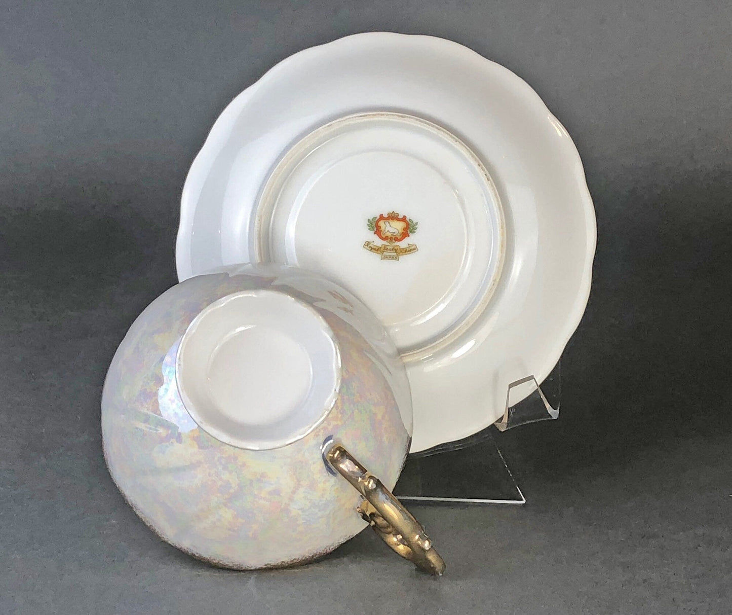 Antique Cup and Saucer Set by Royal Sealy China, Japan. Yellow Cup and Saucer with Rich Gold Decor and Iridescent Background Outside.