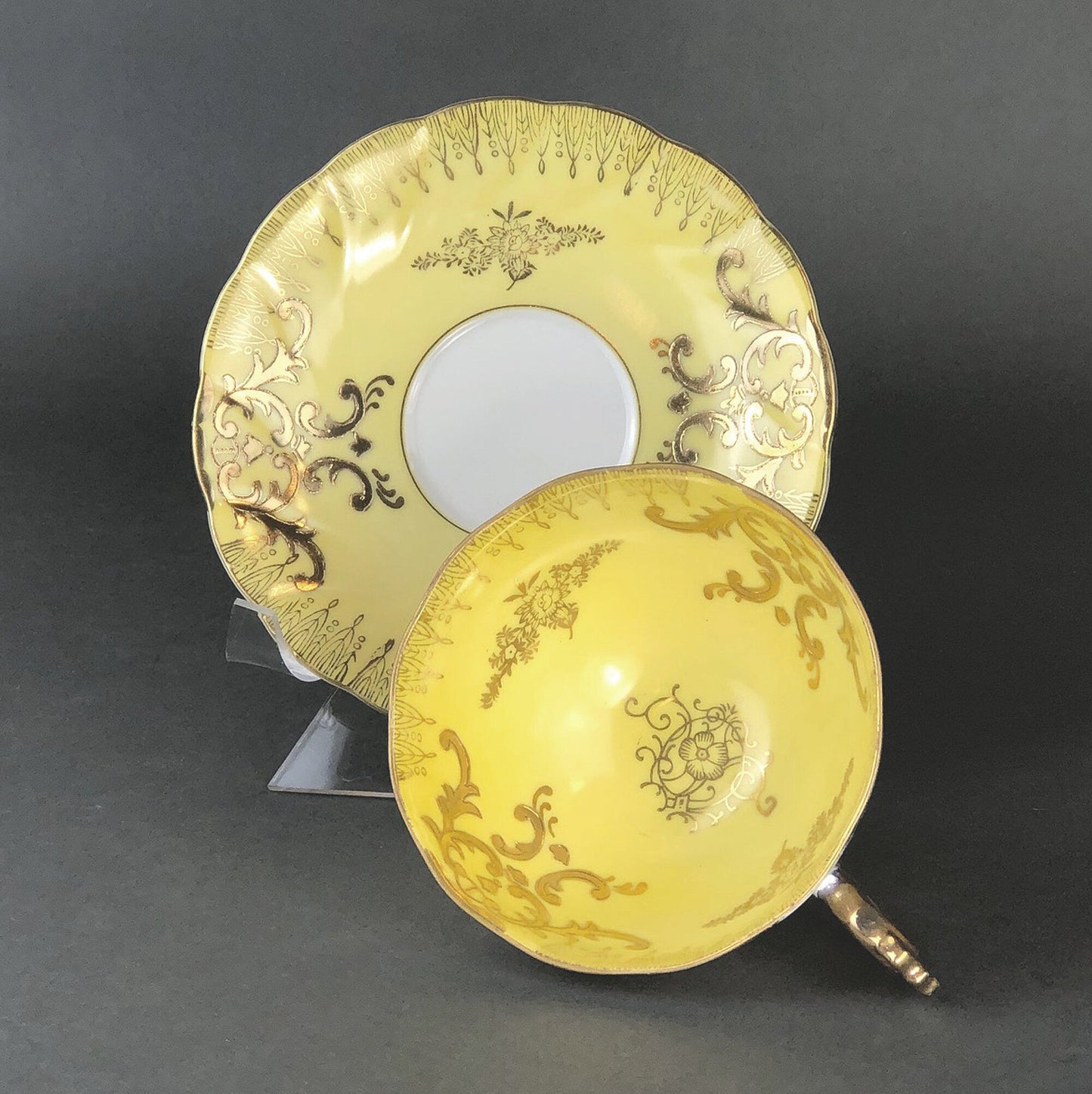 Antique Cup and Saucer Set by Royal Sealy China, Japan. Yellow Cup and Saucer with Rich Gold Decor and Iridescent Background Outside.