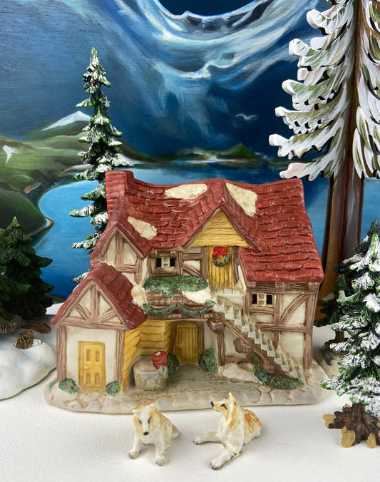 Christmas Village Farm House with Red Roof. Illuminated Building Holiday Decoration.