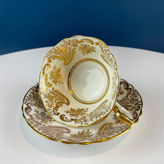 White and Gold Cup and Saucer. Paragon Porcelain, By Appointment to Her Majesty the Queen Potters. Dining Room Cabinet Display.