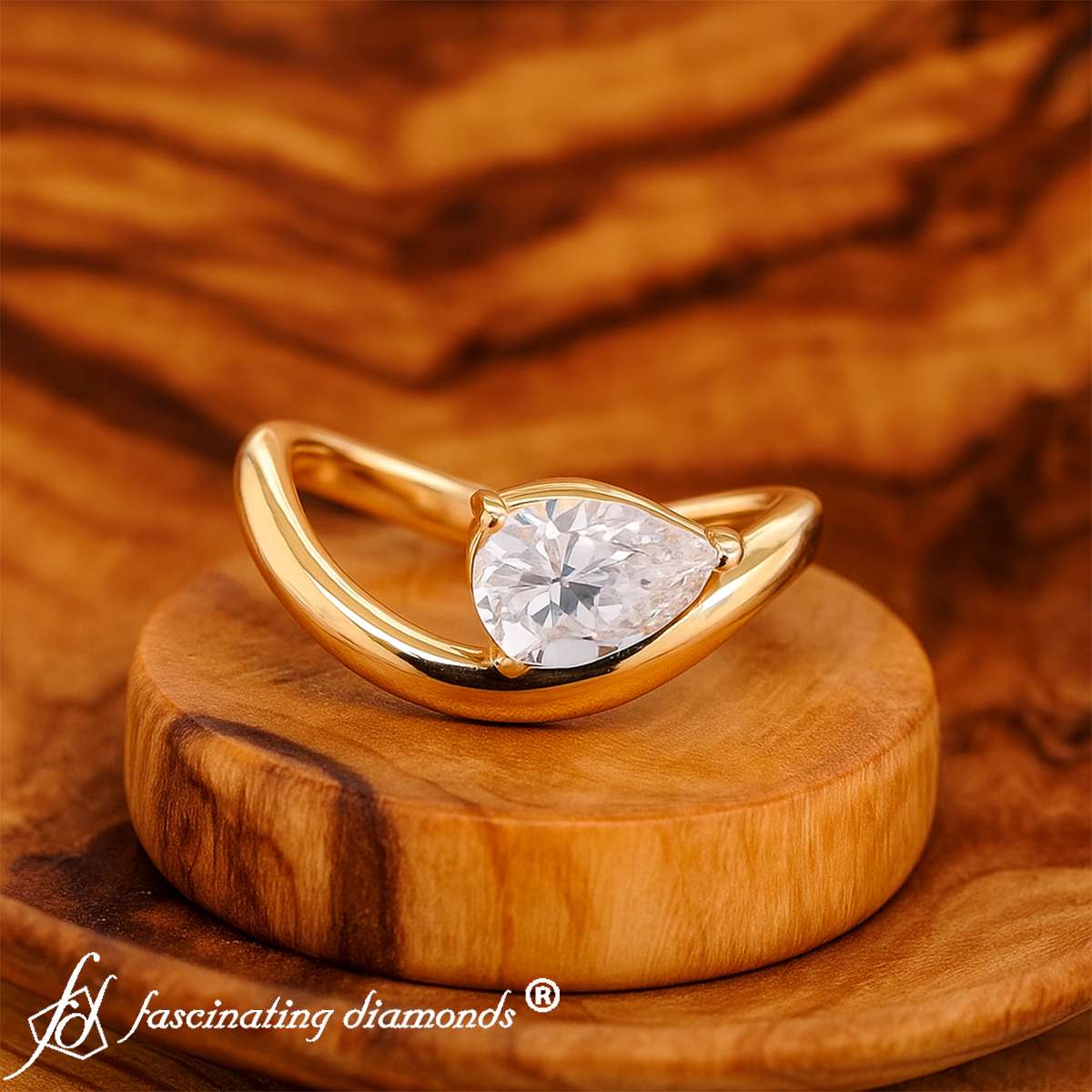 Pear Shaped Curve Shank Solitaire Diamond Ring